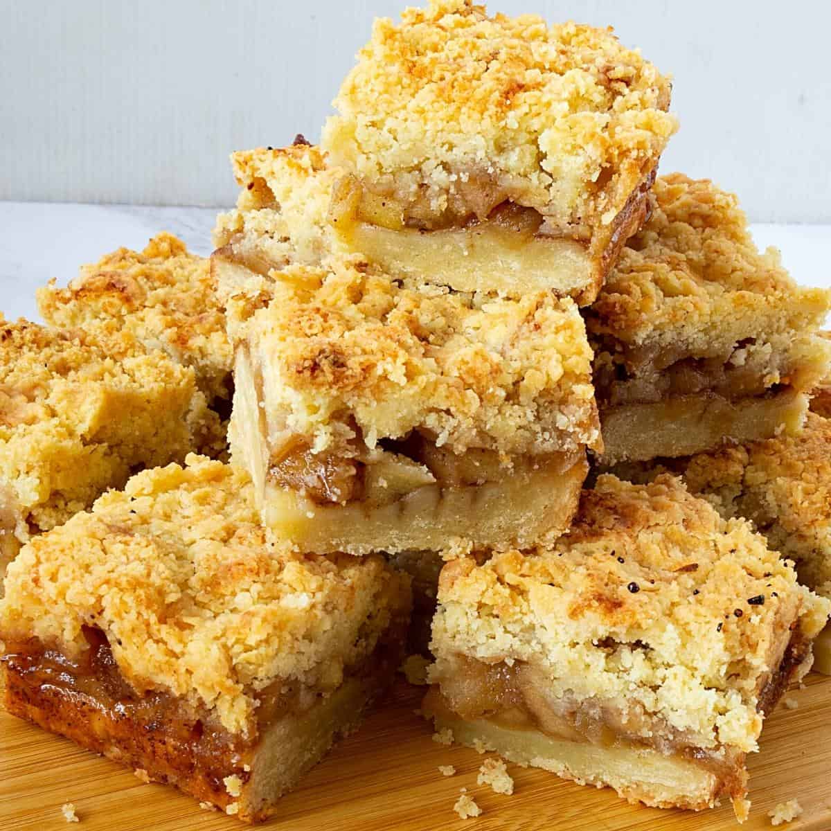 A stack of apple bars. on a wooden board.