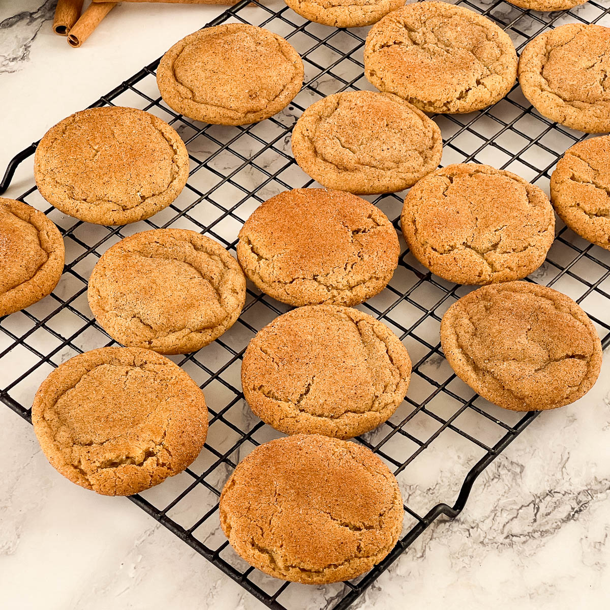A wire rack with fresh cookies.