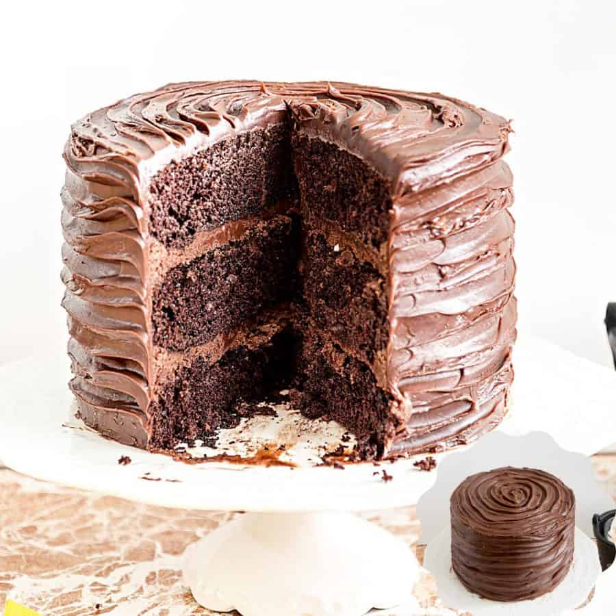 A sliced chocolate cake on the cake stand.