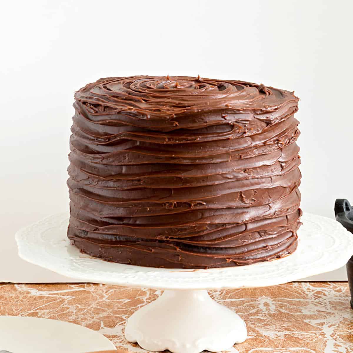 A ganache frosted chocolate cake.