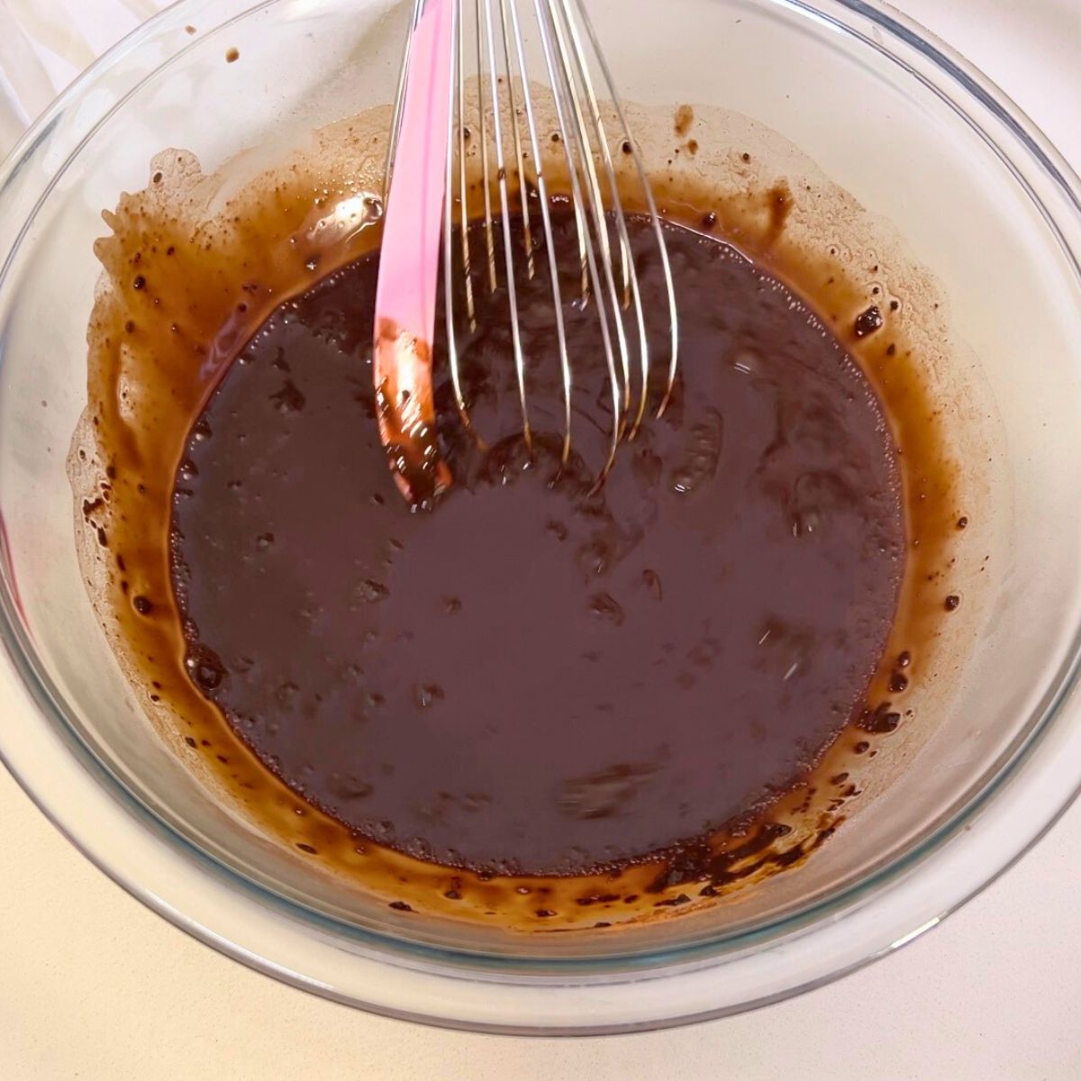 A Glass bowl with cocoa paste.