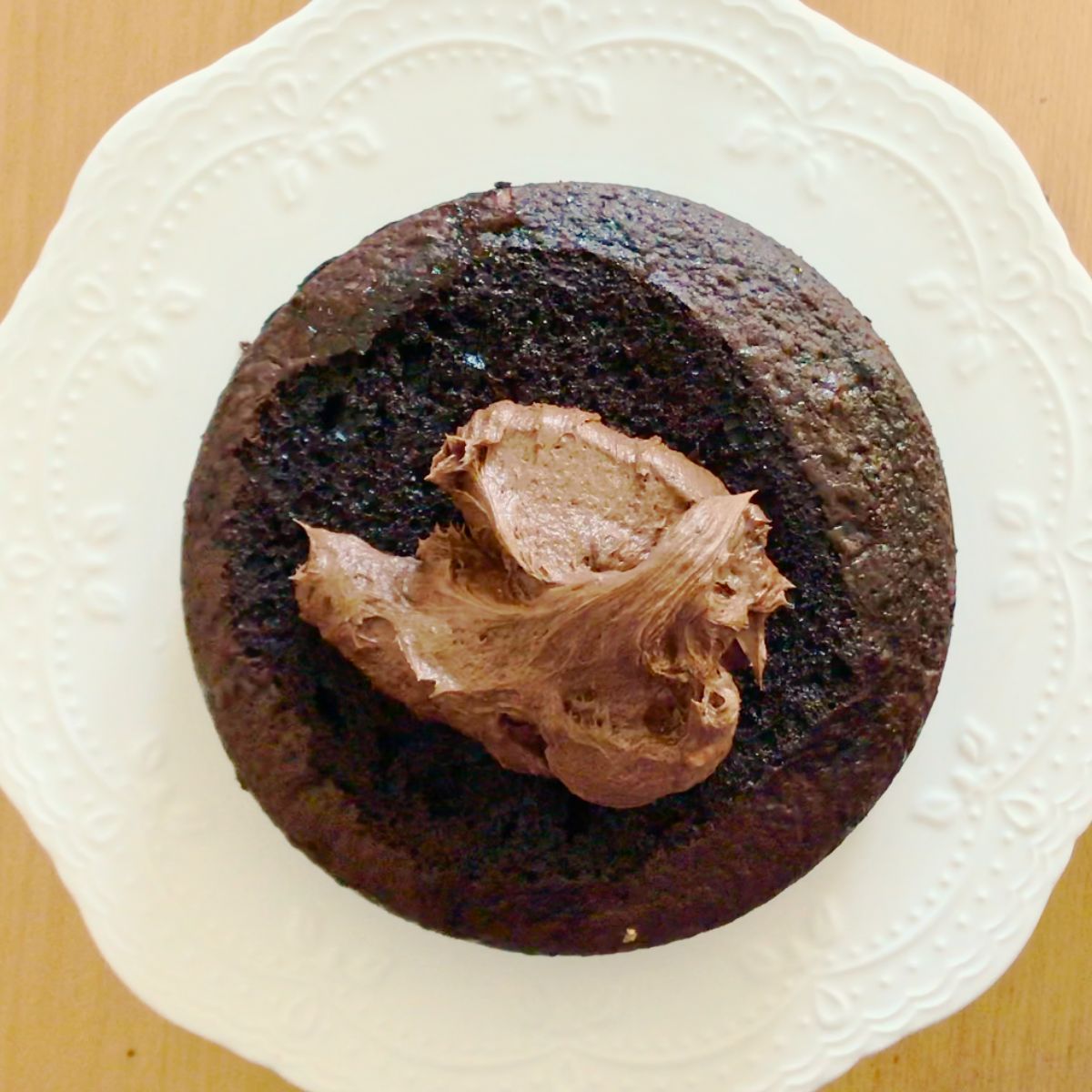A chocolate cake frosted with chocolate buttercream.