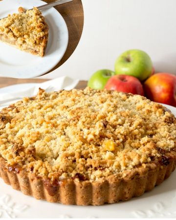 Apple crumble pie on a cake stand.