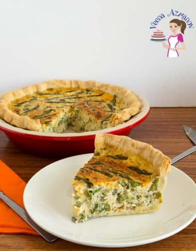 A slice of asparagus and leek quiche on a plate.