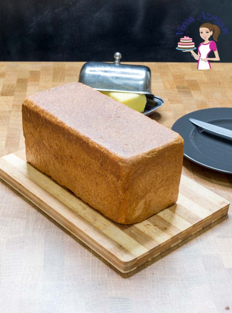 Pullman sandwich bread on a wooden cutting board.