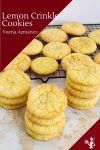 A stack of lemon crinkle cookies on a table.