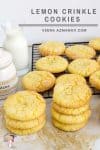 A stack of lemon crinkle cookies on a table.