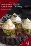Three cupcakes with maple buttercream frosting on a table.
