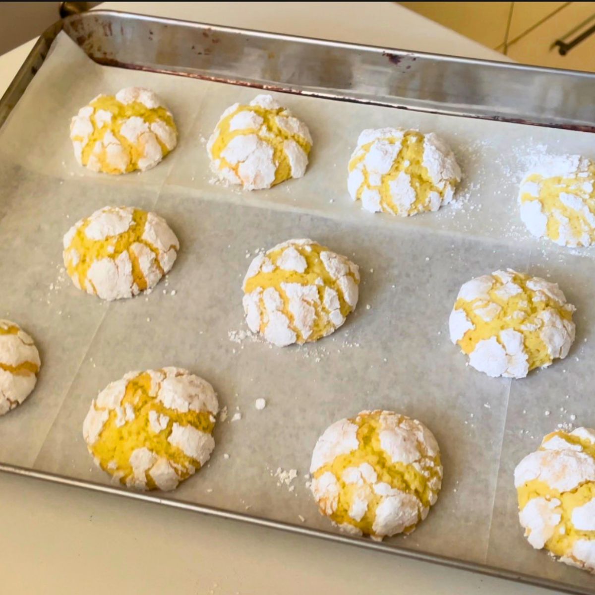 Lemon Crinkle cookies on the table.