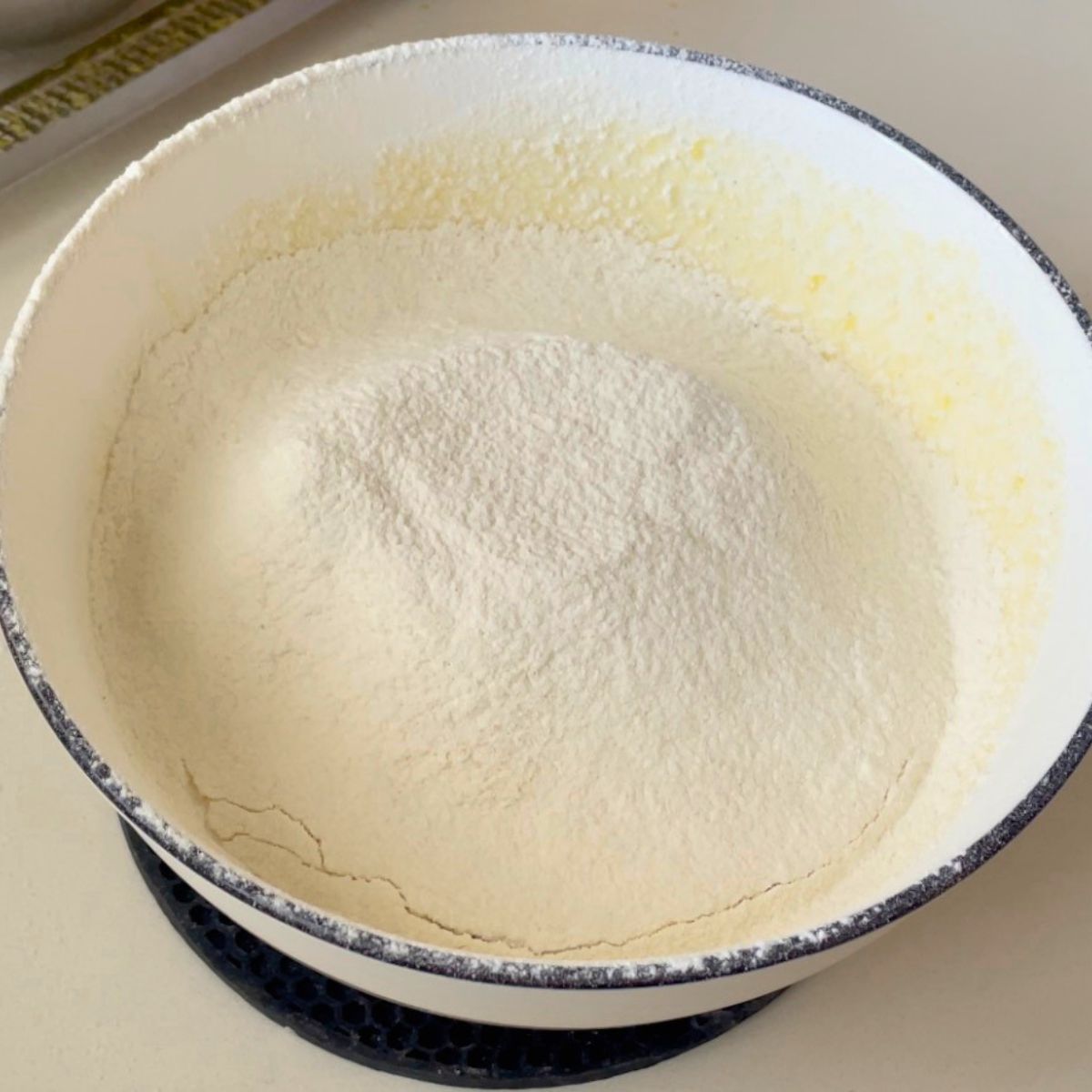 A white bowl making cookie dough.