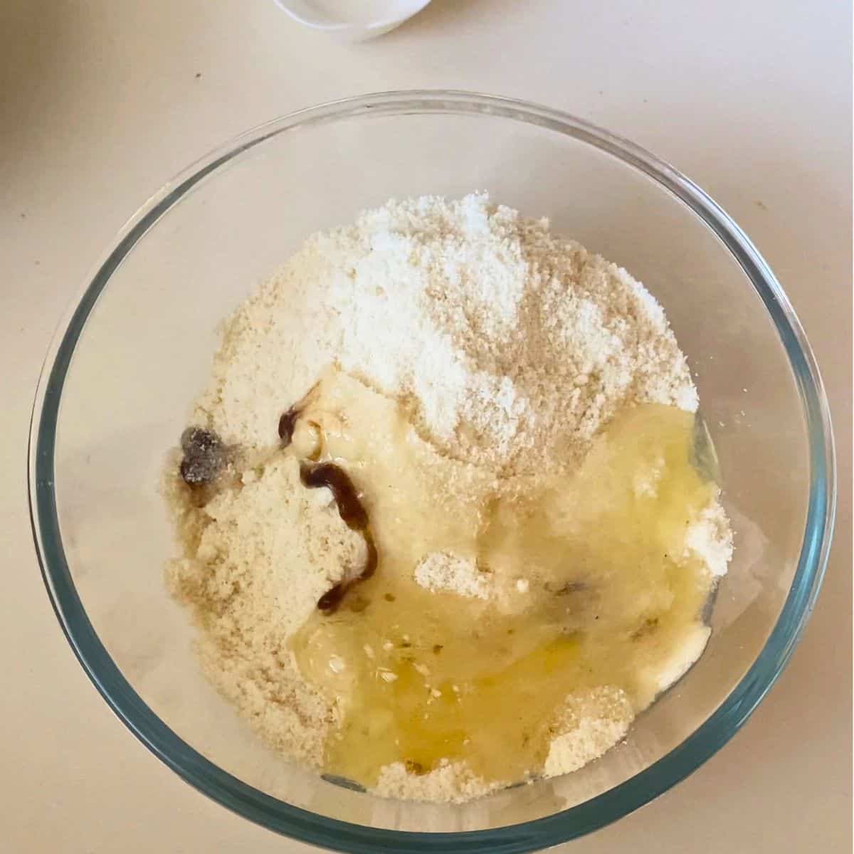 Adding wet ingredients to the dry ingredients.