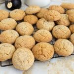 Soft almond cookies on a wire rack.