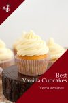 A Frosted vanilla cupcake on a stand.