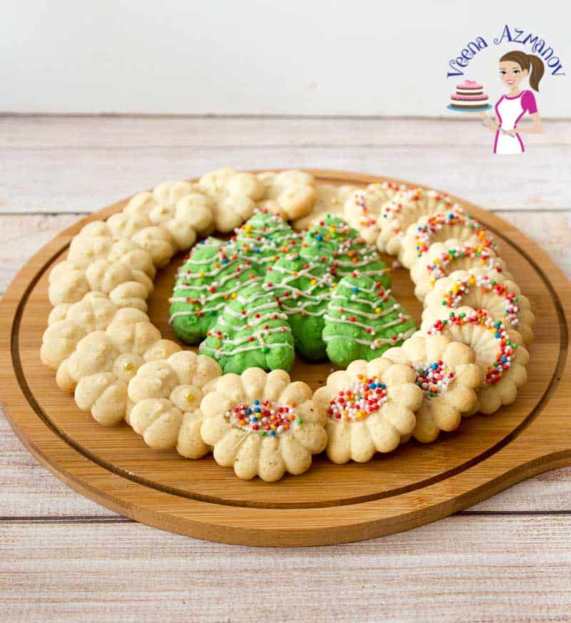 Christmas cookies arranged on a wooden tray.