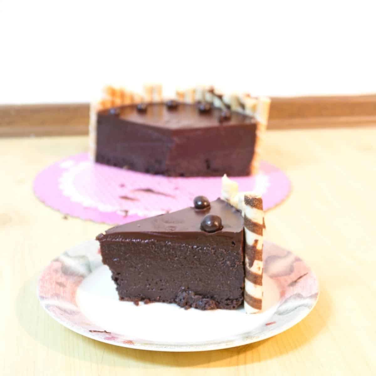A slice of flourless chocolate birthday cake.