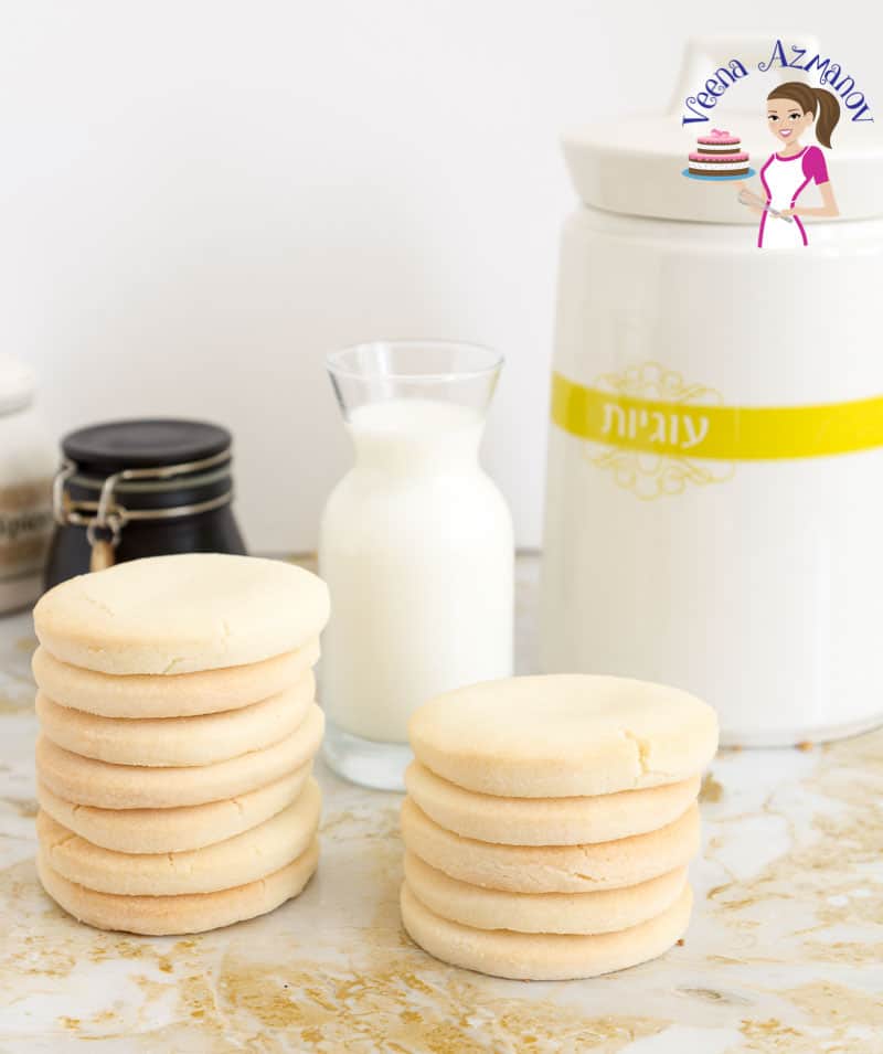 Two stacks of gluten-free sugar cookies on a table.
