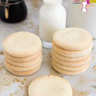 A stack of gluten-free sugar cookies on a table.