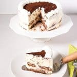 A sliced tiramisu cake on the table.