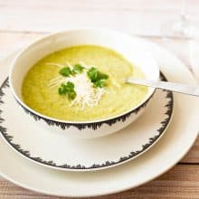 A bowl with cream of broccoli soup.