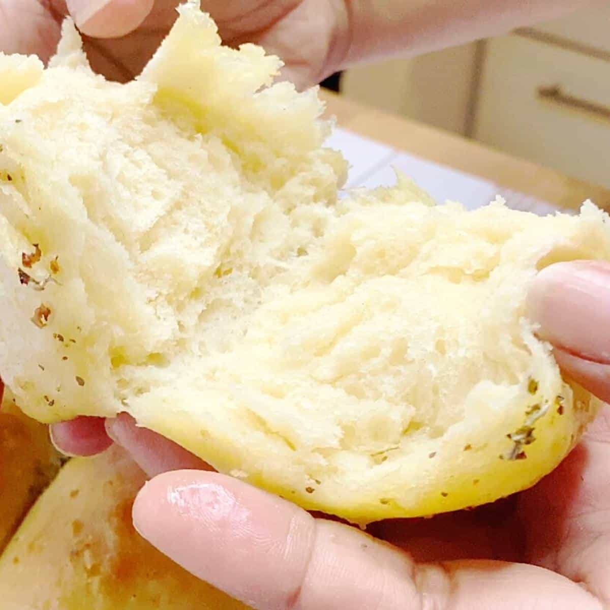Showing the inside of a garlic roll.