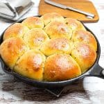 Garlic rolls baked in a cast iron skillet.