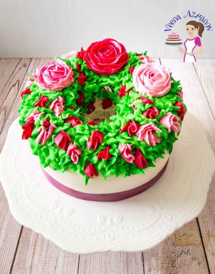 A cake decorated with flowers made with Korean buttercream frosting.