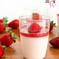 A glass with Strawberry Panna Cotta.