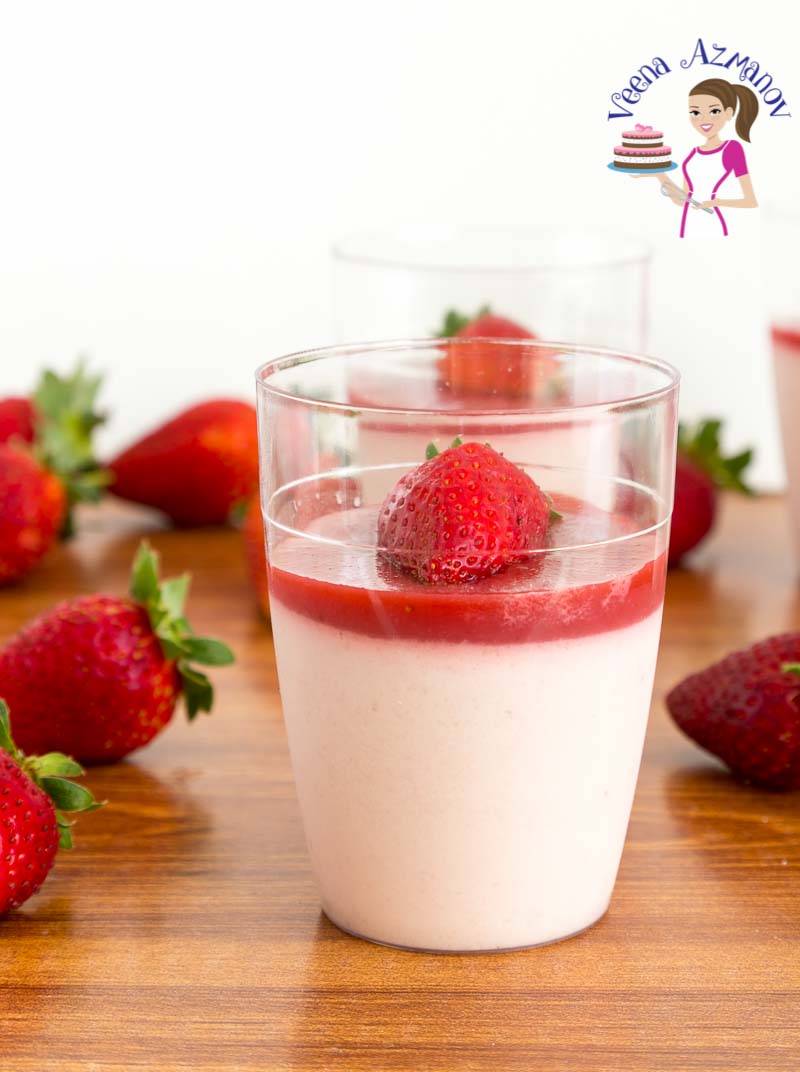 A glass with Strawberry Panna Cotta.