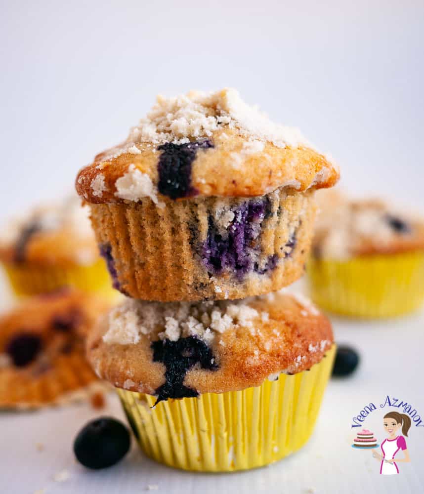 A blueberry muffin on top of another blueberry muffin.