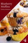 A blueberry muffin on top of another blueberry muffin.