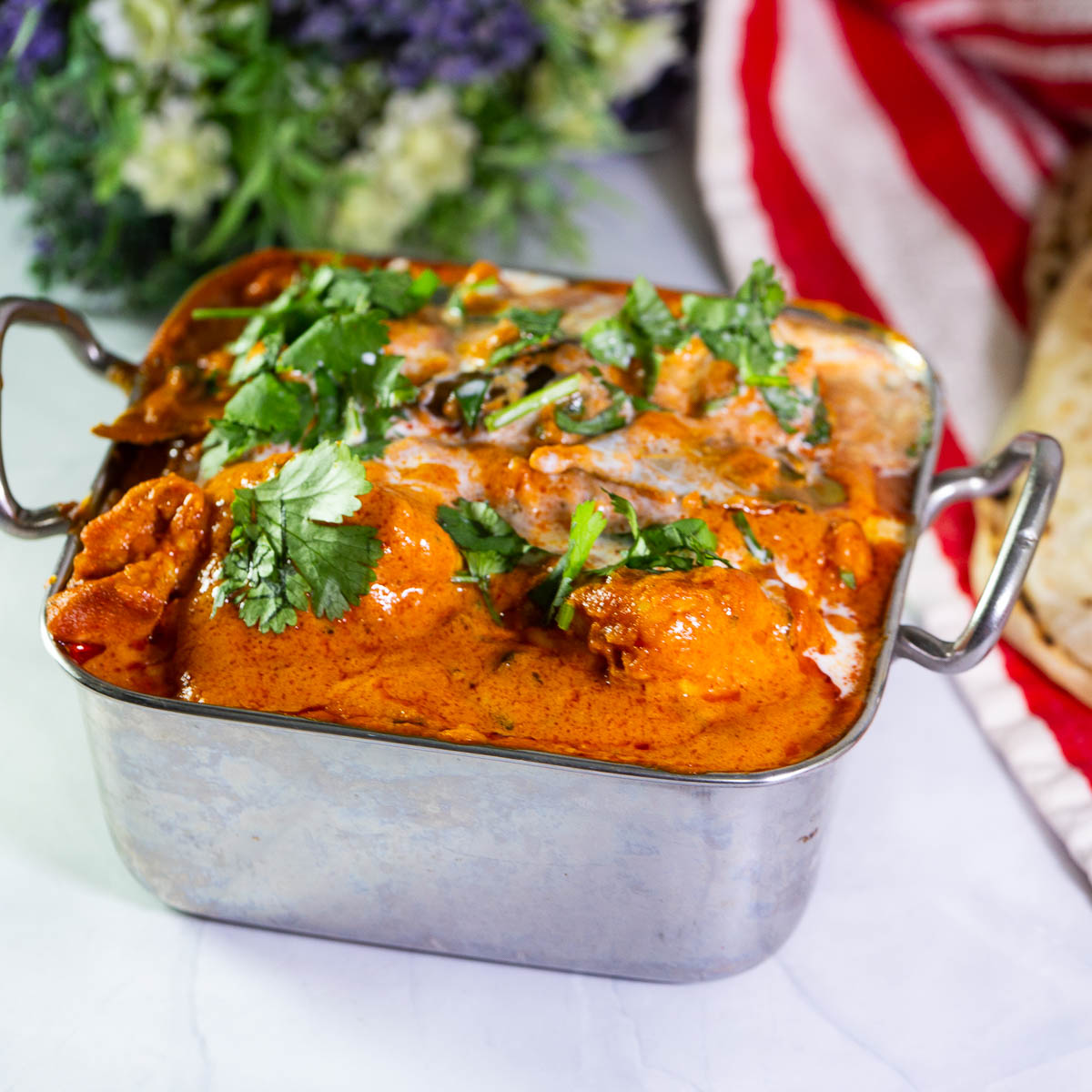 Indian serving dish with murgh makhani.