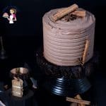Cardamon cake with mocha buttercream on a stand.