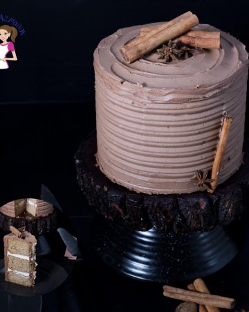 Cardamon cake with mocha buttercream on a stand.
