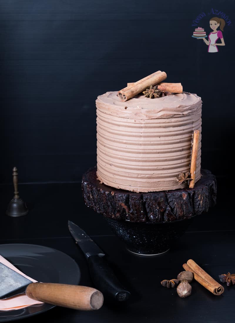 Cardamon cake with mocha buttercream on a stand.