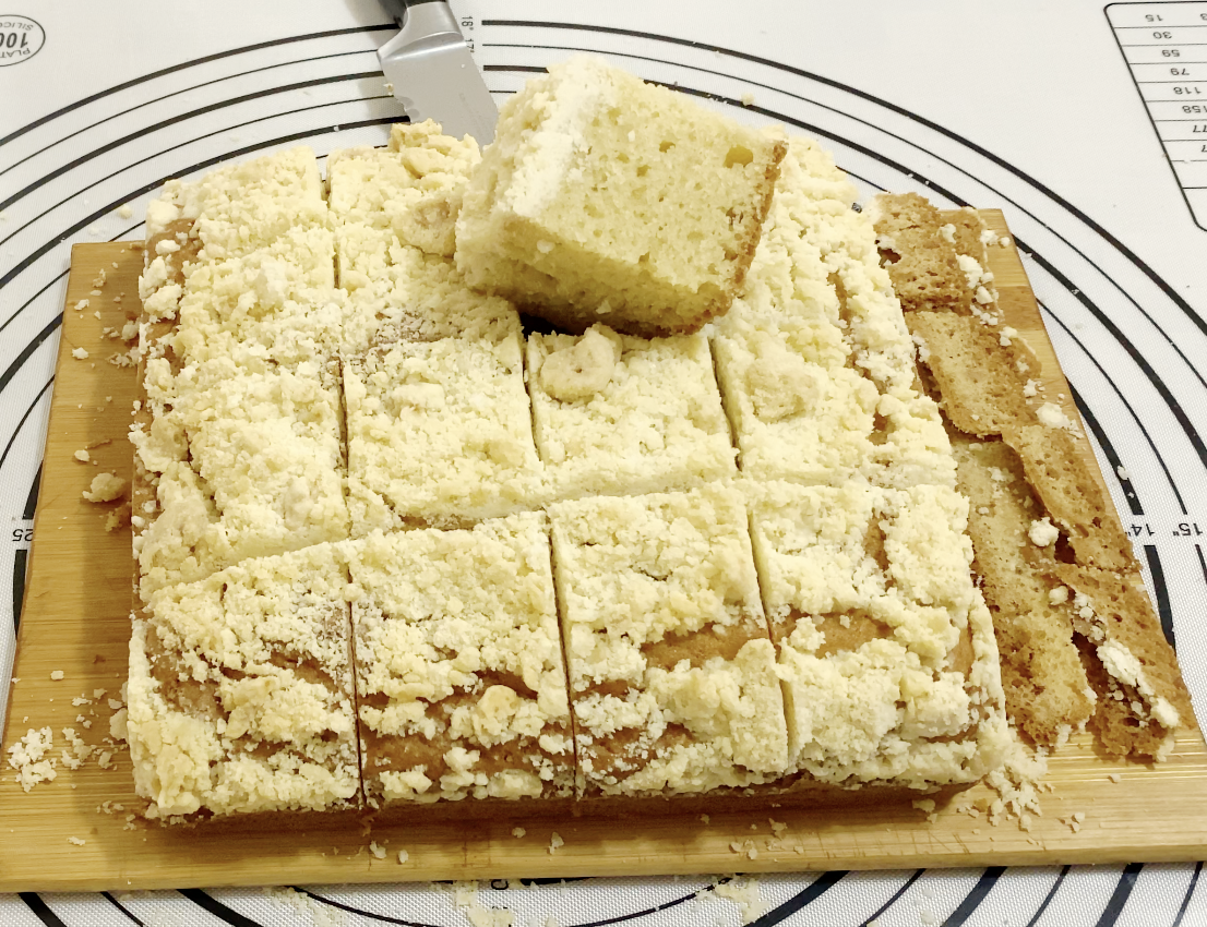 Crumble coffee cake on the cake board.