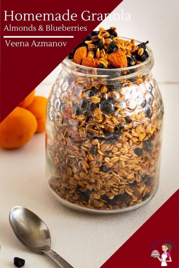 A jar with homemade granola and blueberries.