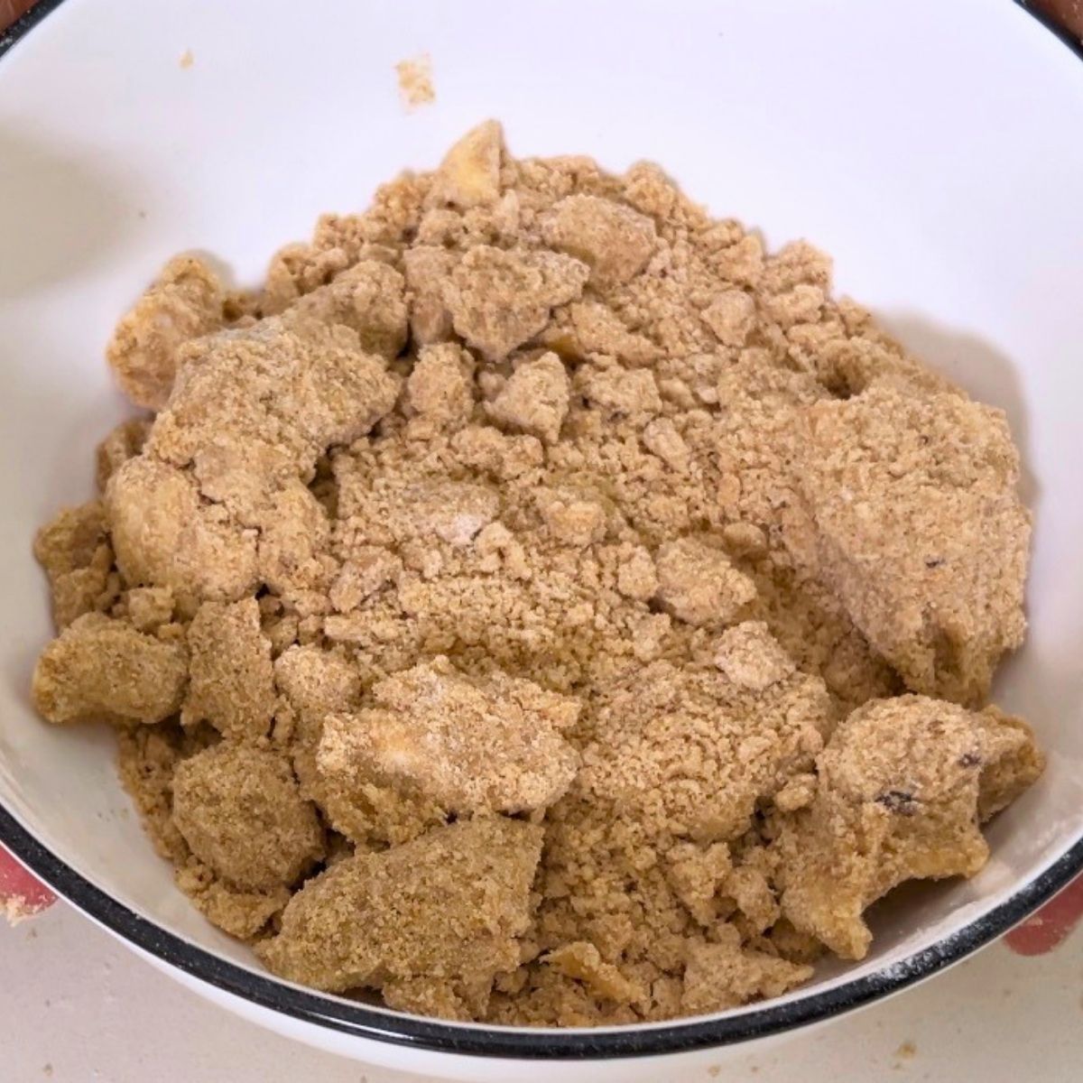 A bowl with cinnamon crumble.