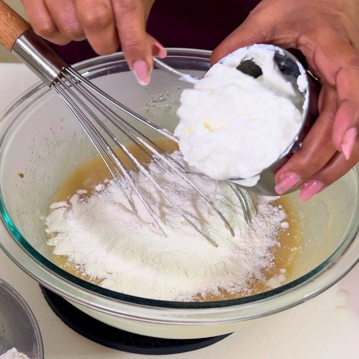 Add flour mixture and sour cream to the cake batter.