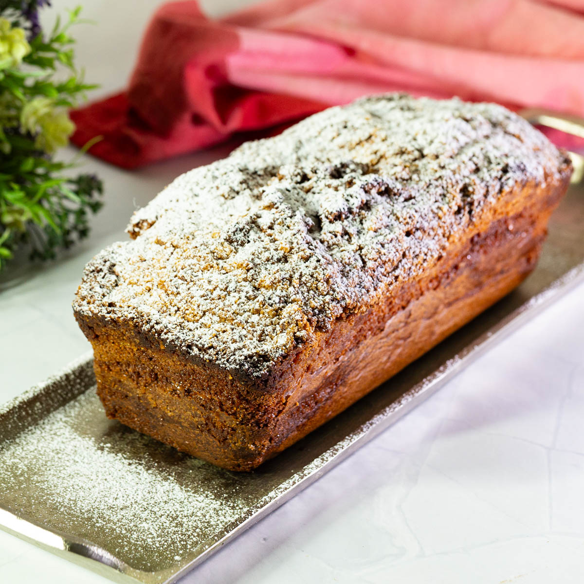 Coffee cake dusted with powdered sugar.