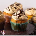Caramel cupcake on a wooden board.