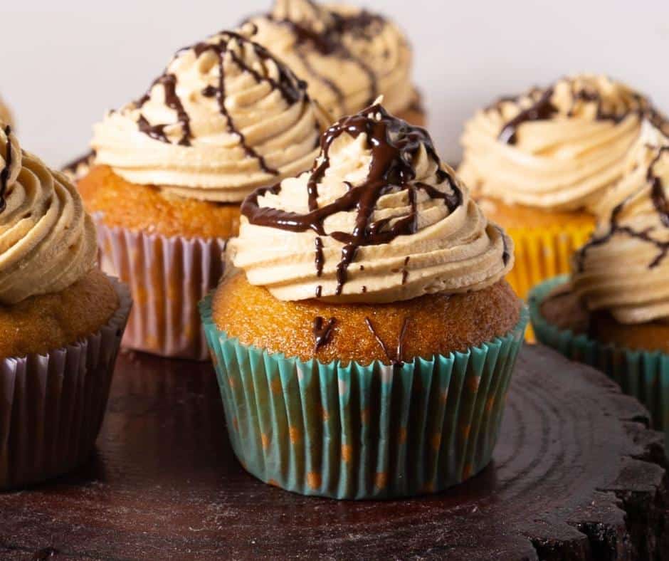 Caramel cupcake on a wooden board.