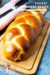 A close up of a Challah bread on a cutting board.