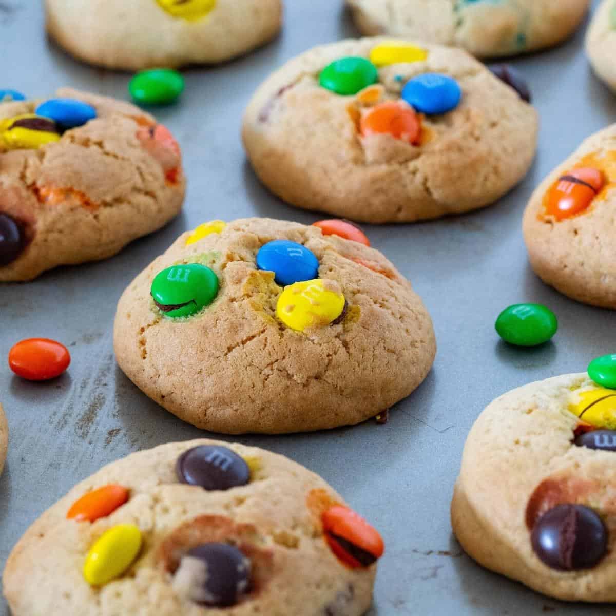 Cookies with M&M candy on a table.