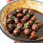 A skillet with meatballs.