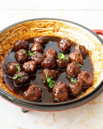 A pan with balsamic glazed meatballs.