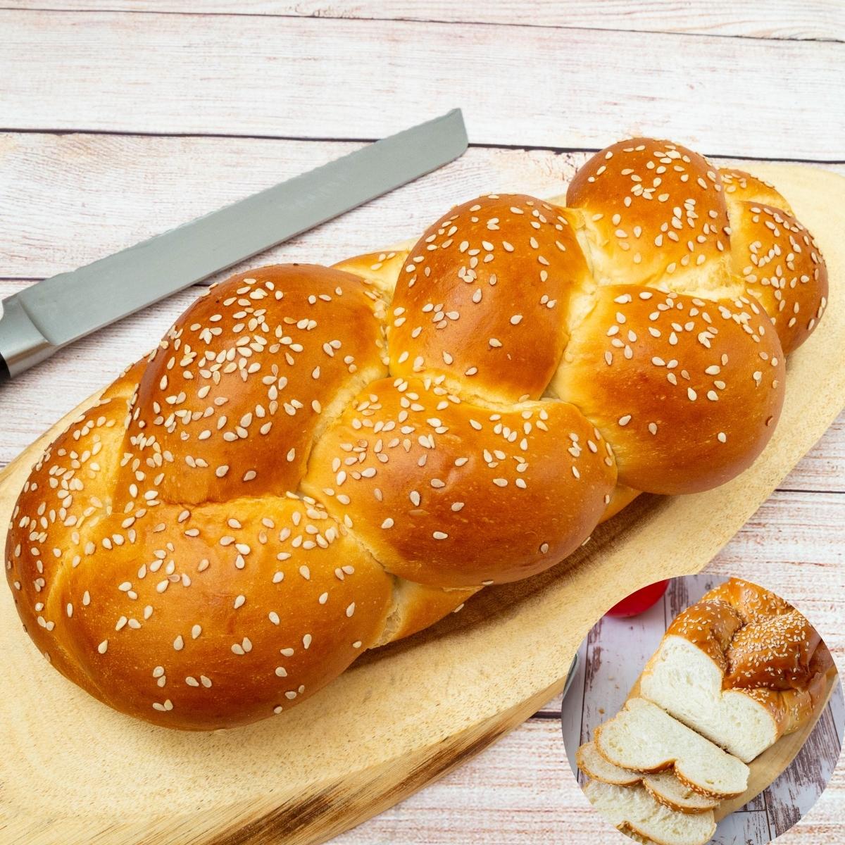 A four braid challah on a wooden board.