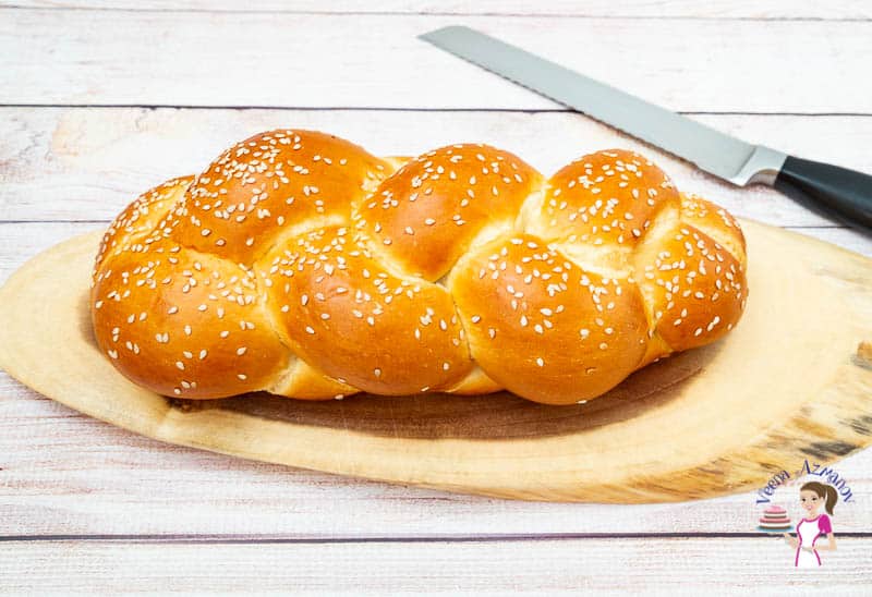 Challah bread on a wooden board.