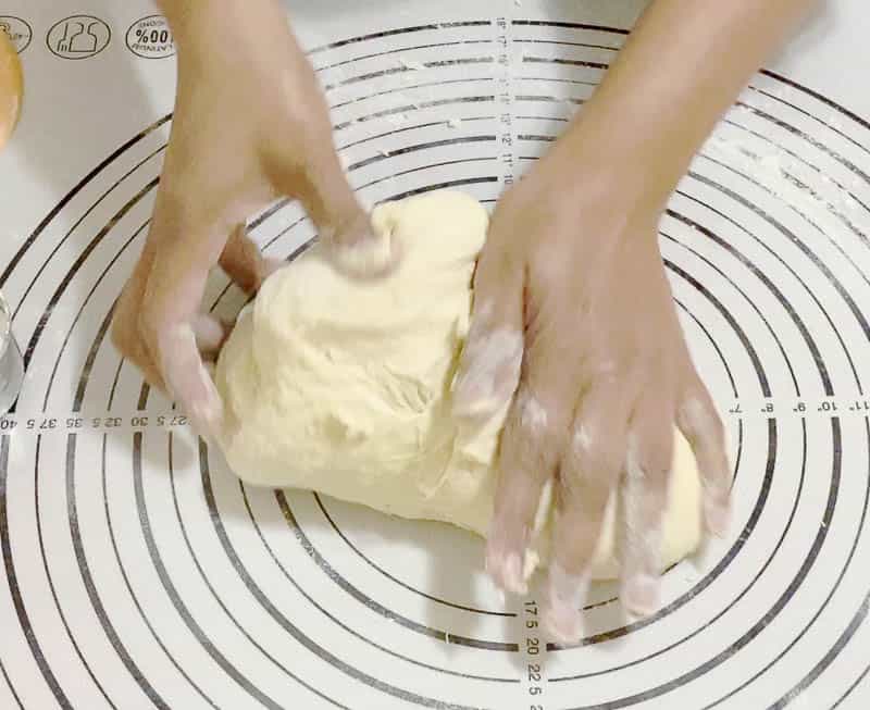 Kneading the dough for the braided challah