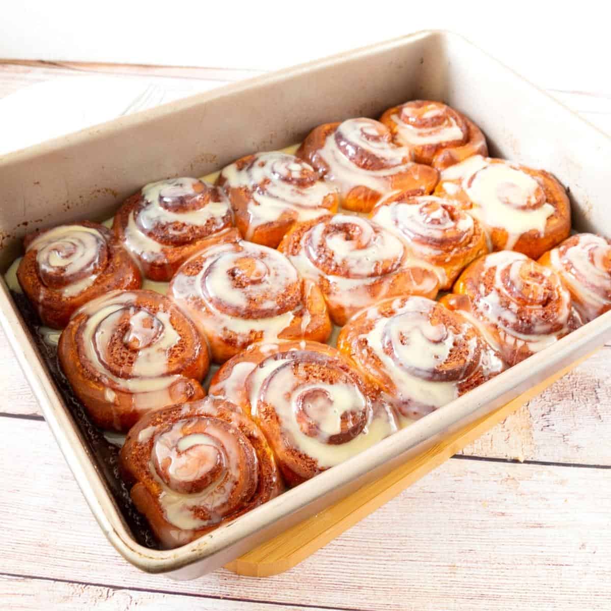 Cinnamon rolls baked in a sheet pan.
