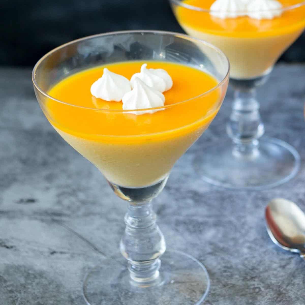 Panna cotta in a glass with mango jello.